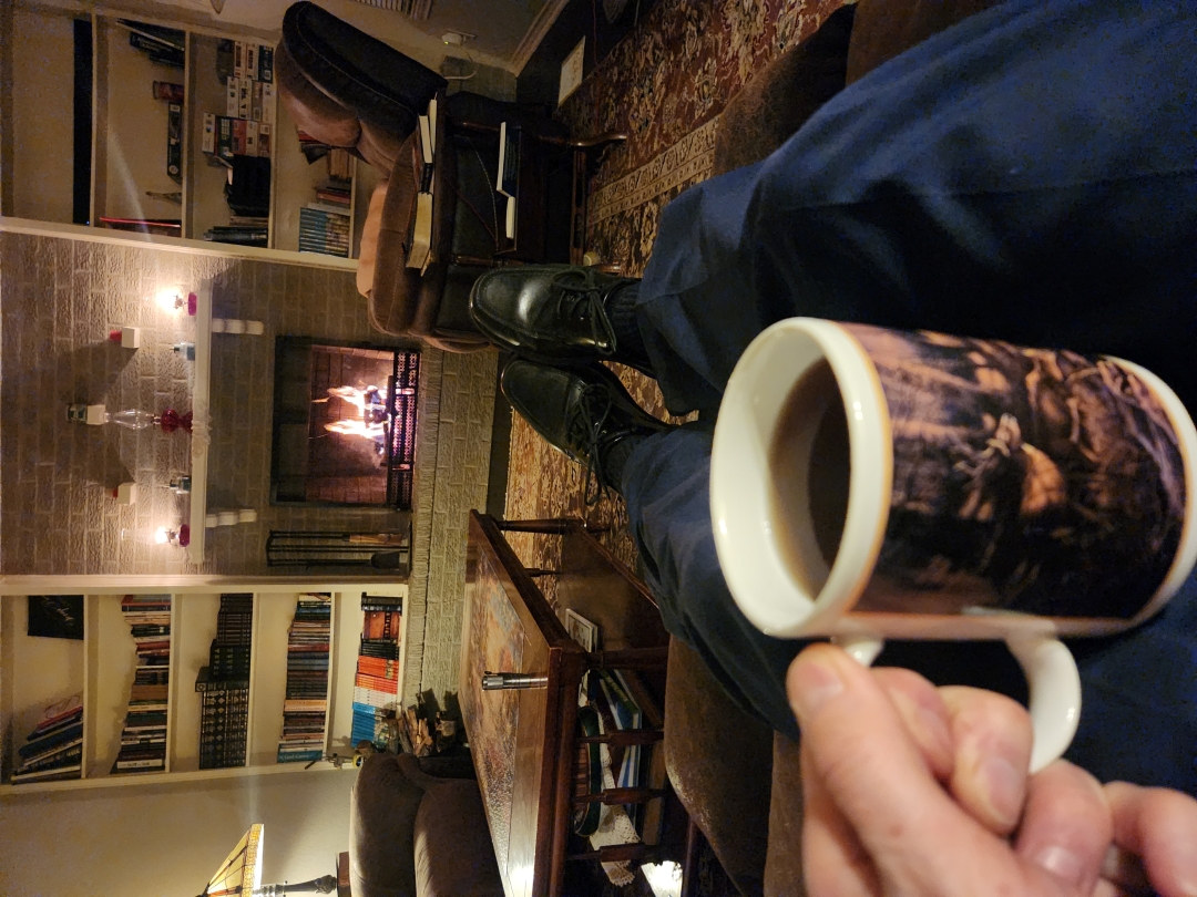 Mug of tea by the fireplace